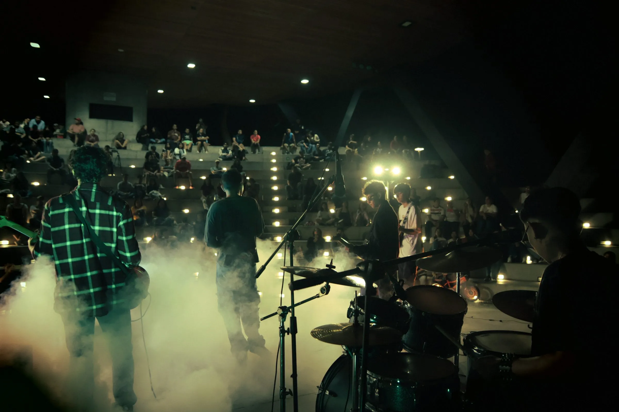 Suddenly playing live, seen from behind the drum kit